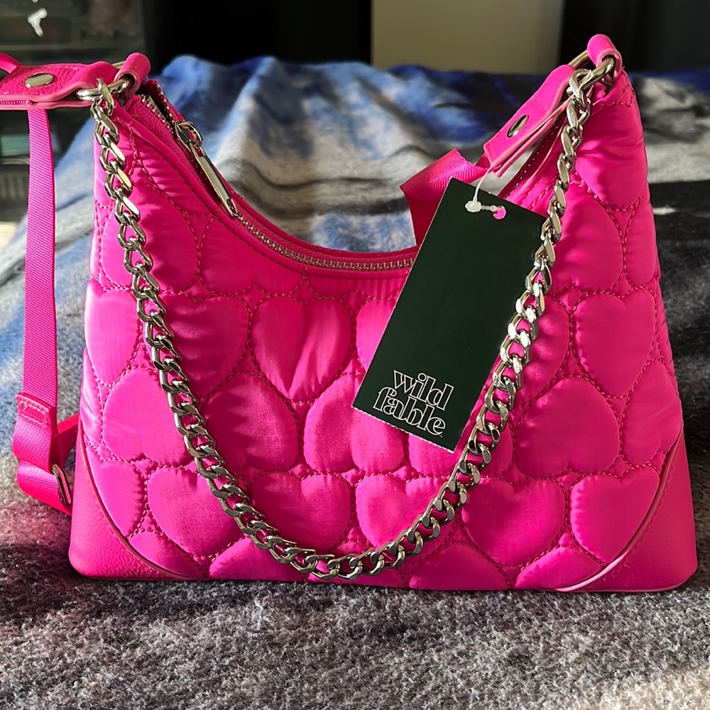 NWT….super cute handbag….adjustable strap…